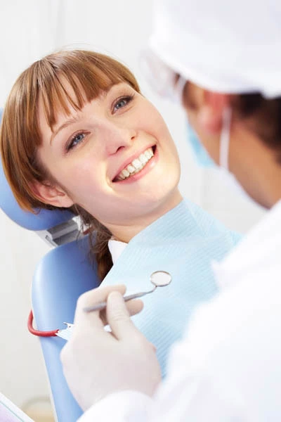 woman getting her teeth whitened at Flossy Smiles in Miami, FL