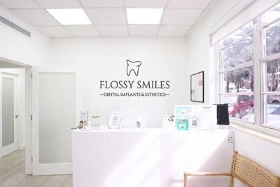 front office insurance and financing desk at Flossy Smiles Dental Implants & Esthetics in Coral Gables, FL